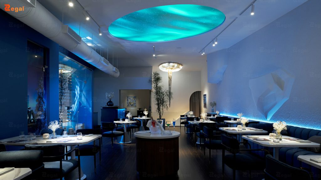 The restaurant's interior features an artfully printed ceiling combined with modern lighting.