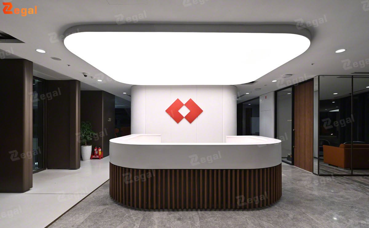 In the reception area specifically, a large-scale stretch ceilings feature serves as a visual focal point, making the welcoming space stand out while appearing more professional and inviting.